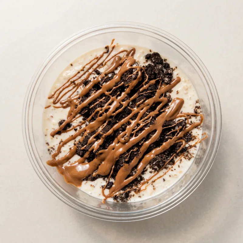 Oreo overnight protein oats in a clear tub
